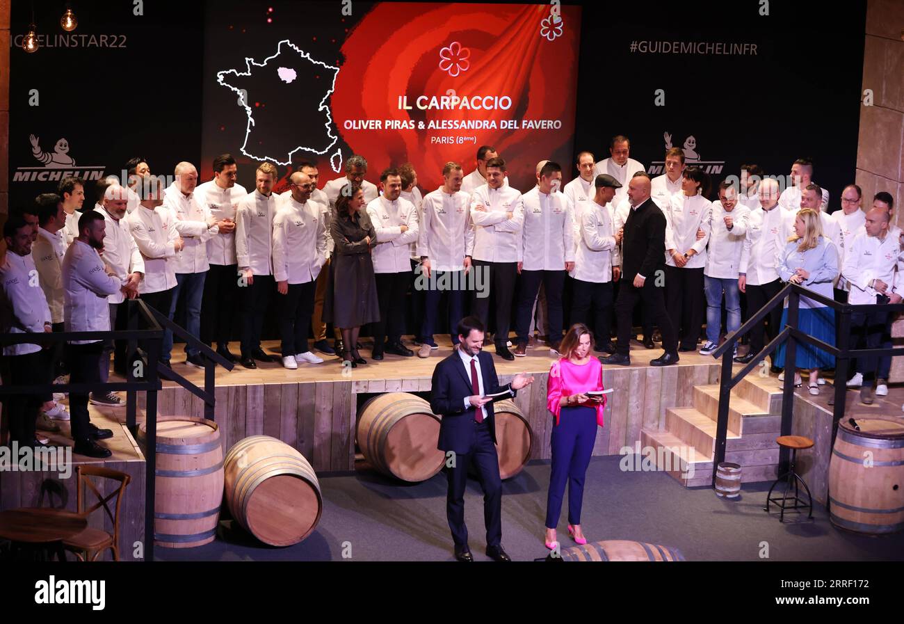 220323 -- COGNAC, March 23, 2022 -- Chefs celebrate after being awarded a first Michelin star during the 2022 edition of the Michelin Guide award ceremony in Cognac, France, March 22, 2022. The Michelin Guide launched its 2022 edition on Tuesday in Cognac, the first time in its 122 years the ceremony has taken place outside Paris. Two restaurants were awarded the highest distinction of three stars.  FRANCE-COGNAC-MICHELIN GUIDE-AWARD CEREMONY GaoxJing PUBLICATIONxNOTxINxCHN Stock Photo