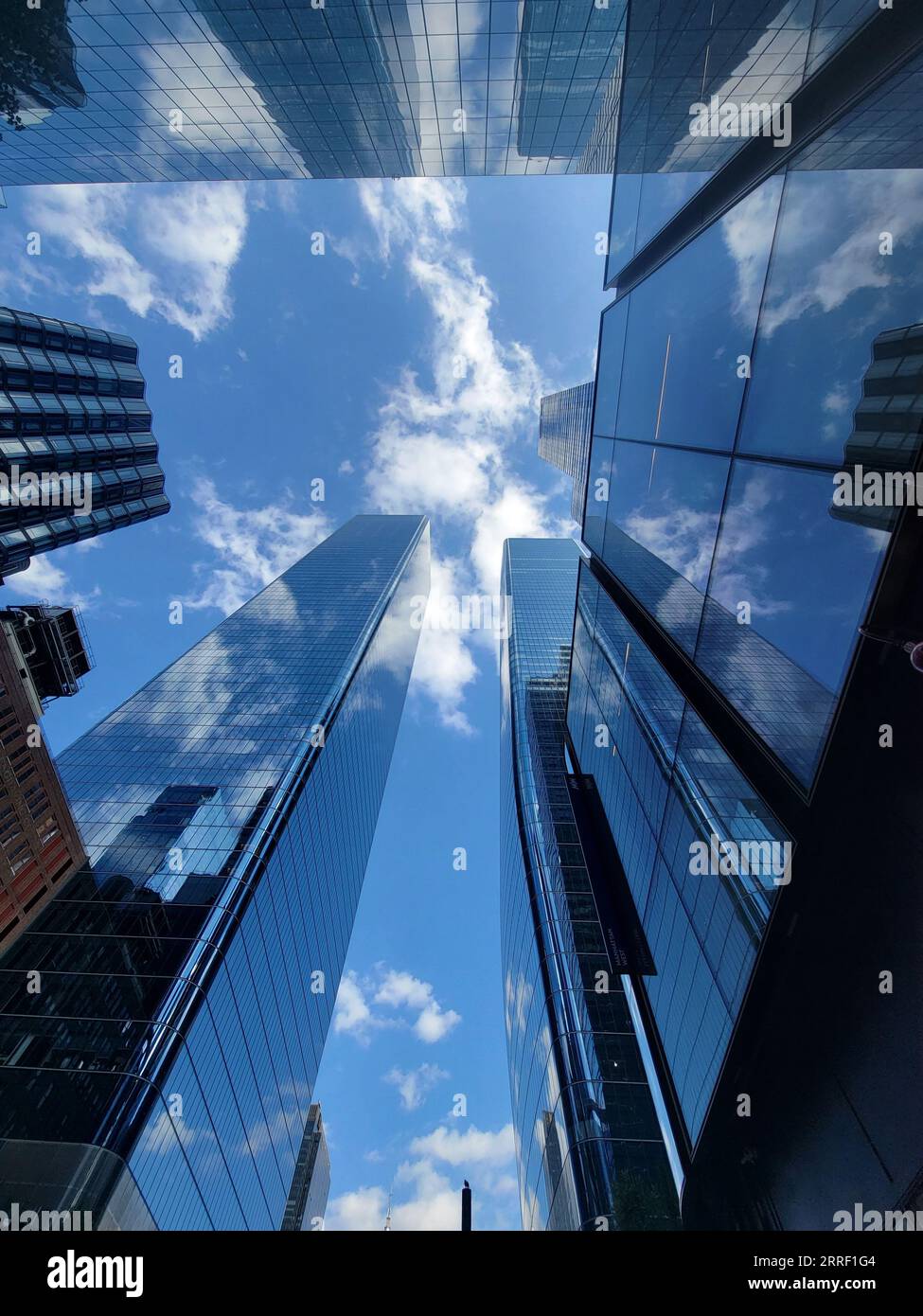 An Aerial view of a vibrant city skyline featuring a cluster of modern ...