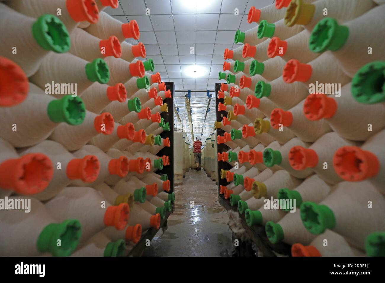 cotton yarn in the workshop of spinning mill Stock Photo - Alamy