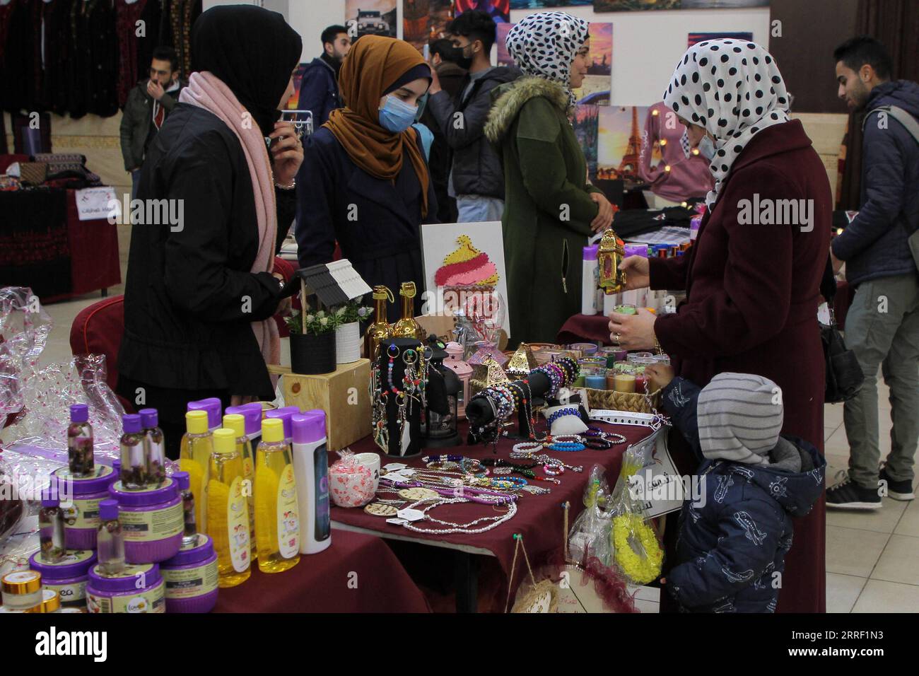 220324 -- GAZA, March 24, 2022 -- People visit a special hotel bazaar dubbed Creative Land in Gaza City, March 21, 2022. TO GO WITH Feature: Creative bazaar in Gaza offers young entrepreneurs coveted business opportunities Photo by /Xinhua MIDEAST-GAZA CITY-BAZAAR RizekxAbdeljawad PUBLICATIONxNOTxINxCHN Stock Photo