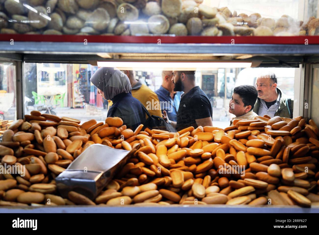 220331 BAGHDAD, March 31, 2022 Customers are seen at a bakery