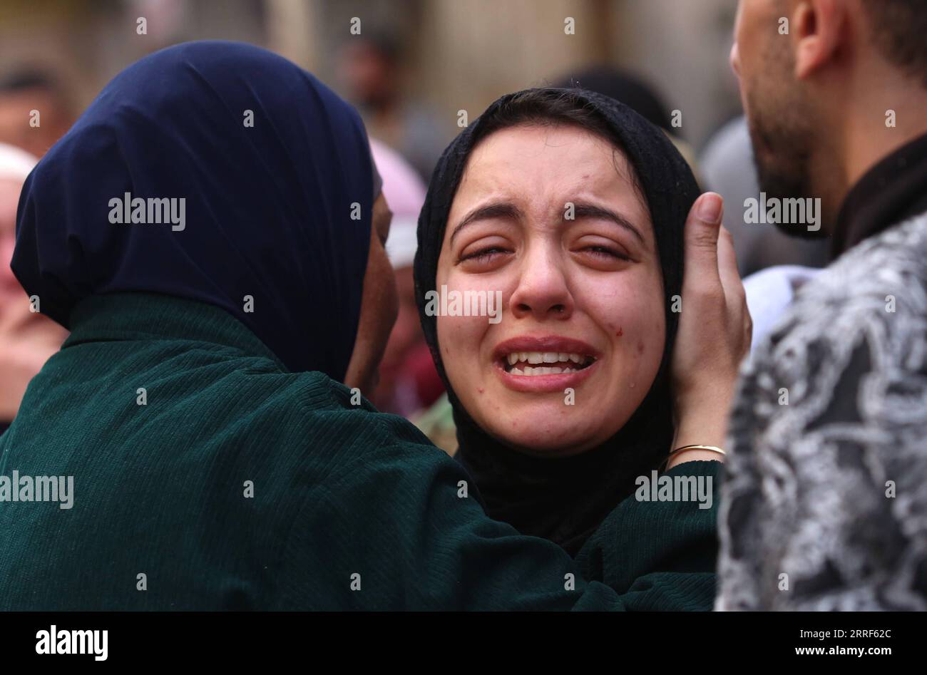 220331 -- JENIN, March 31, 2022 -- A woman mourns during the funeral of victims killed during clashes with Israeli soldiers in the West Bank city of Jenin, March 31, 2022. The Palestinian Health Ministry said that Yazeed al-Sa di, 27, and Sanad Abu Atteya, 17, were killed on Thursday during clashes with Israeli soldiers in the northern West Bank city of Jenin. Photo by /Xinhua MIDEAST-JENIN-FUNERAL NidalxEshtayeh PUBLICATIONxNOTxINxCHN Stock Photo