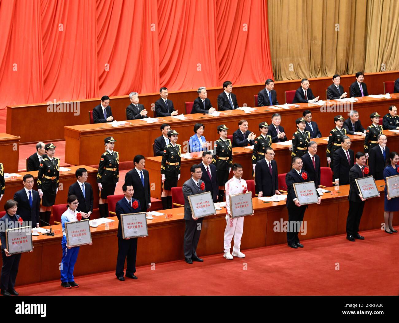 220408 -- BEIJING, April 8, 2022 -- Xi Jinping and other Chinese leaders confer awards on representatives of those who have made outstanding contributions to the Beijing 2022 Olympic Winter Games and the Beijing 2022 Paralympic Winter Games at a gathering held at the Great Hall of the People in Beijing, capital of China, April 8, 2022.  CHINA-BEIJING WINTER OLYMPICS-PARALYMPICS-ROLE MODELS-GATHERING CN ZhaixJianlan PUBLICATIONxNOTxINxCHN Stock Photo