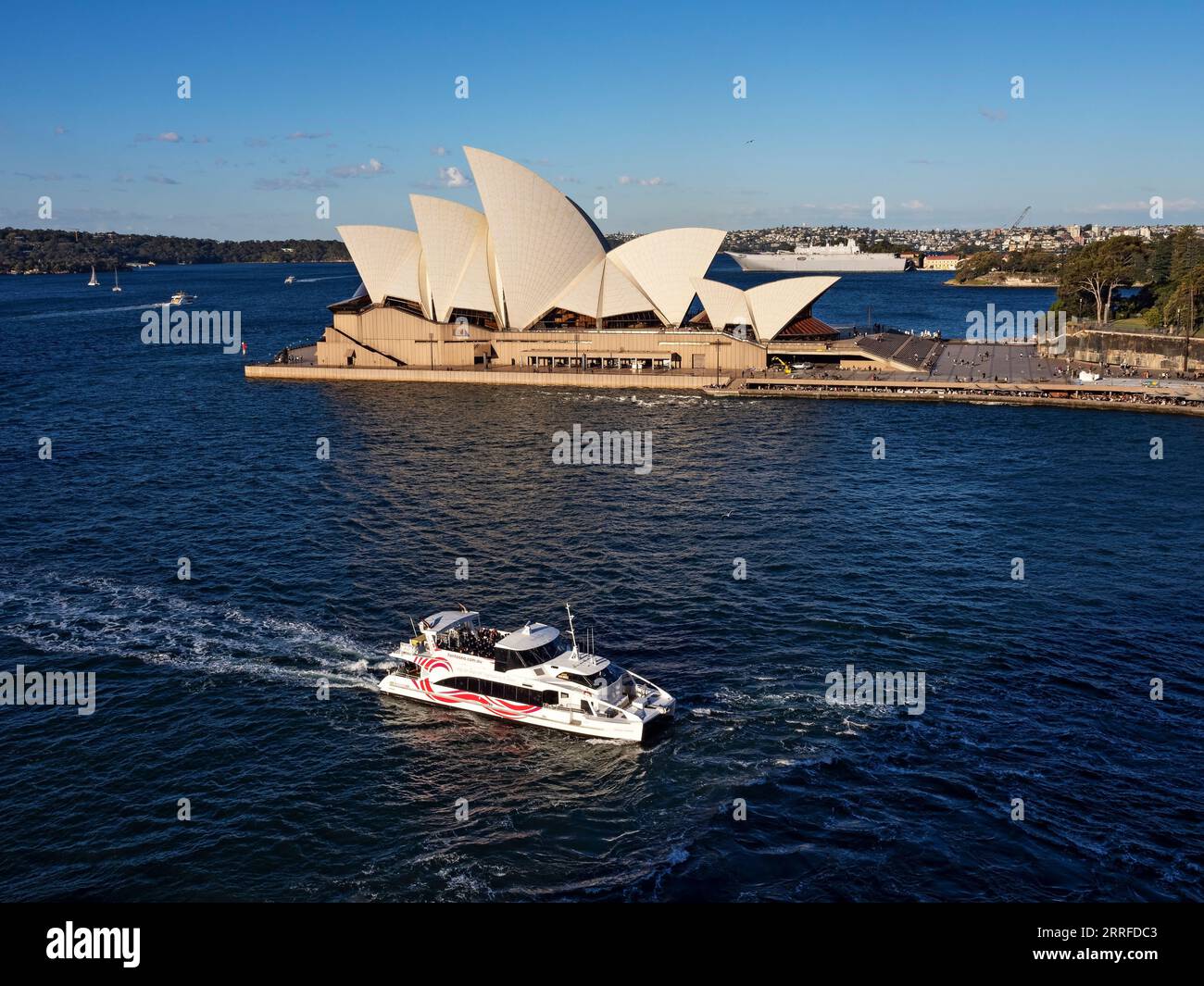 Sydney Australia / A Sydney sightseeing  Fantasea cruise boat  passes the Sydney Opera House. The Fantasea Hopper Cruise boat , heads to Circular Quay Stock Photo