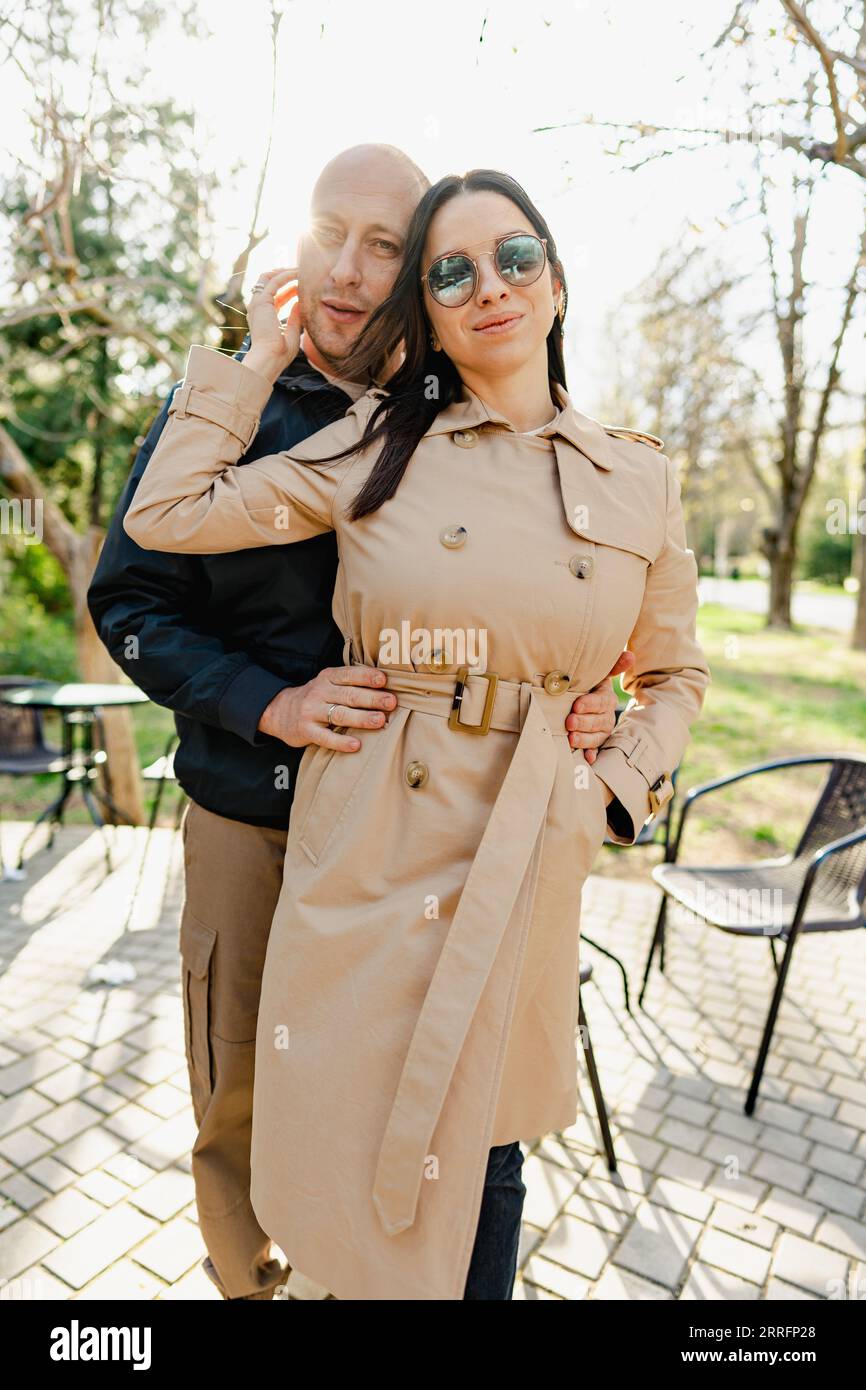 Happy romantic couple enjoying a walk in the park Stock Photo - Alamy