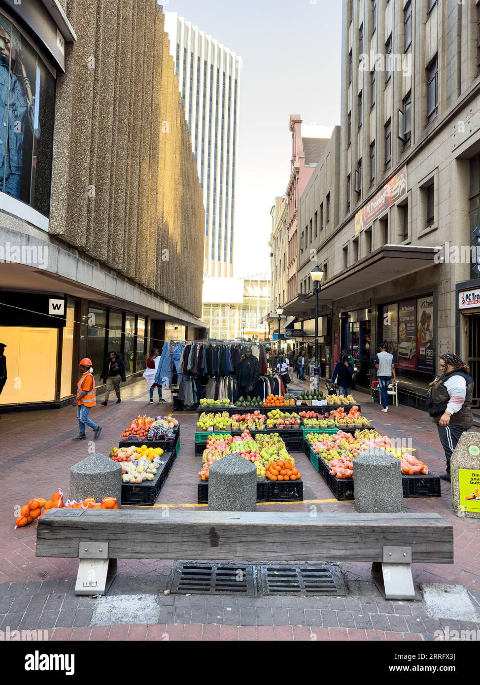The street vendors selling fresh fruit, vegetables and secondhand