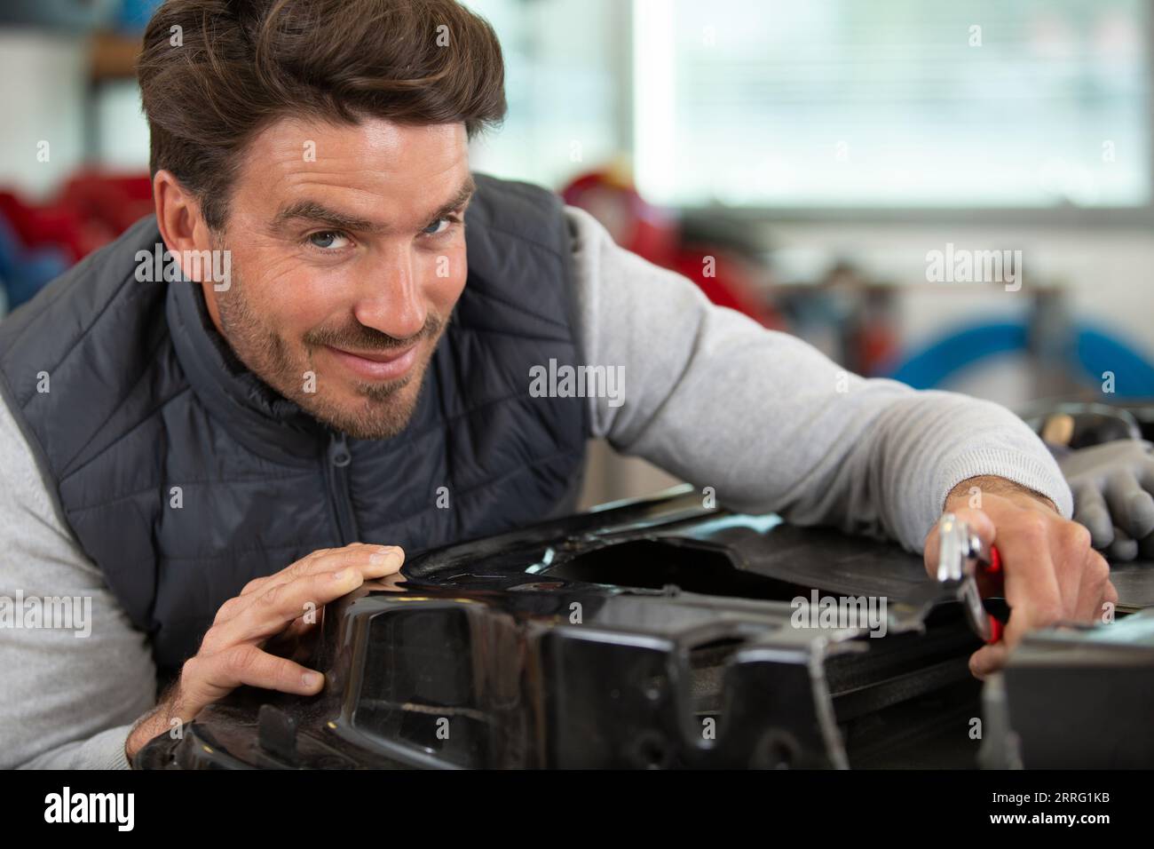 portrait of a mechanic at work in his garage Stock Photo