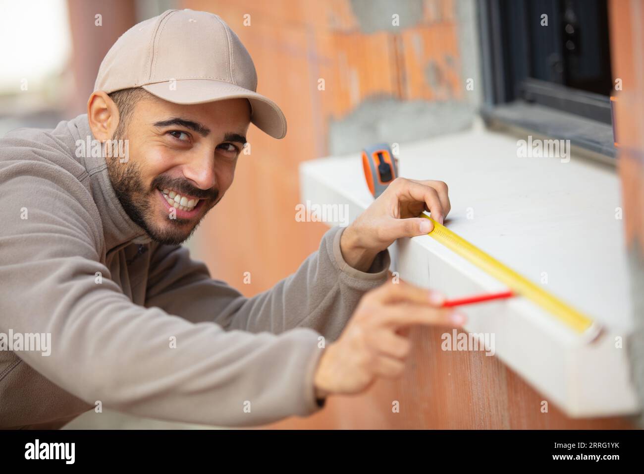 handsome young builder at work Stock Photo