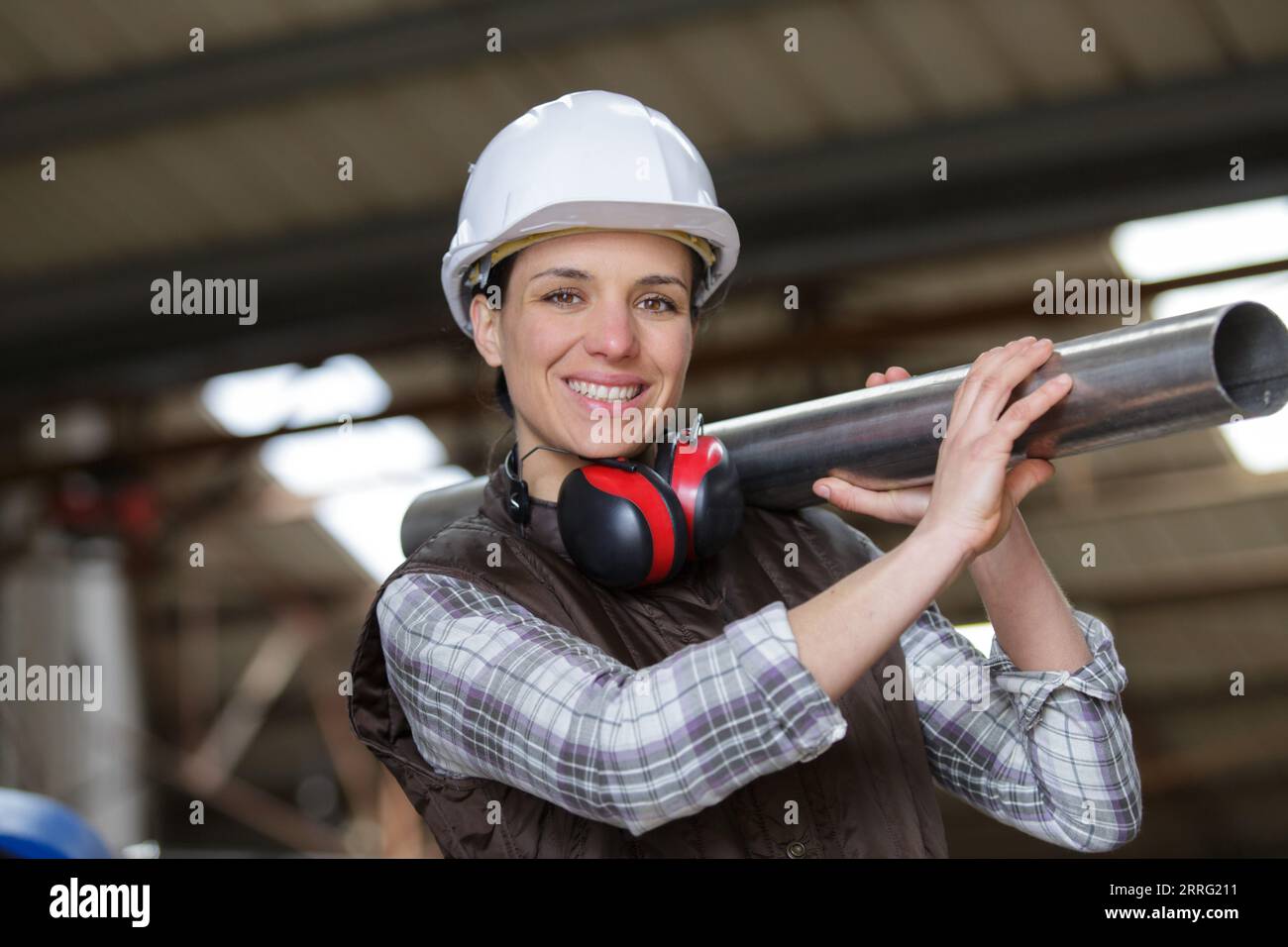 happy female engineer working at power plant Stock Photo