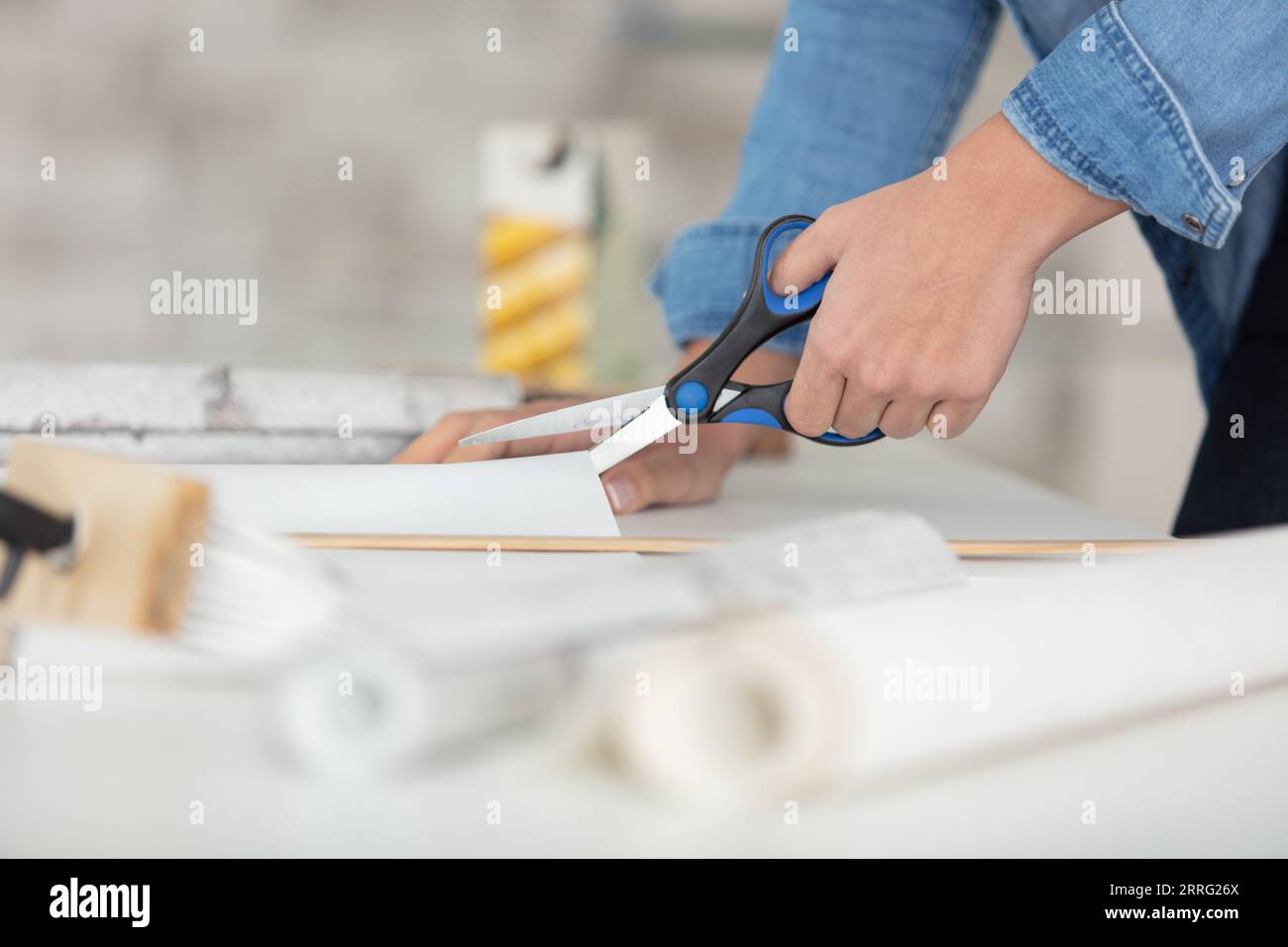 Using Scissors Side close up woman using scissors Stock Photo - Alamy