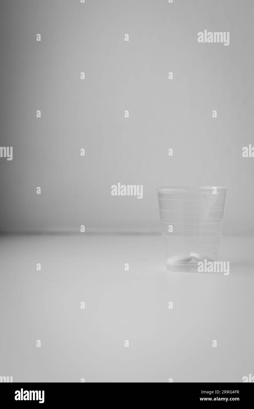 Medication in a cup ready for the patient Stock Photo