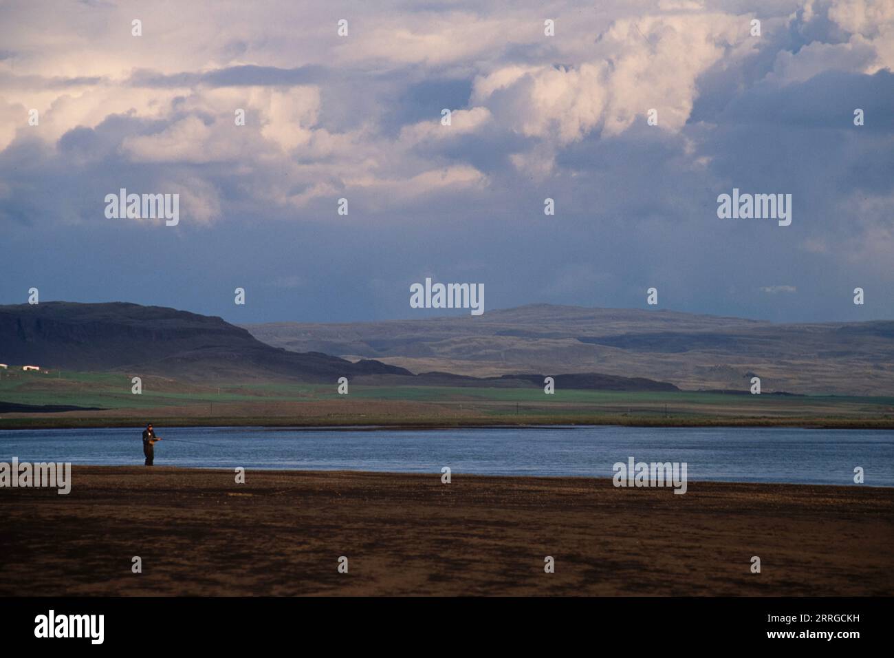 A man fishing at a lake in Iceland Stock Photo