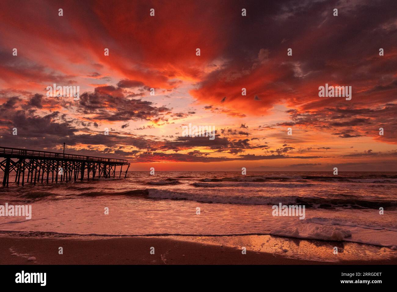 Sunrise over the pawley's island fishing pier showing hurricane damage