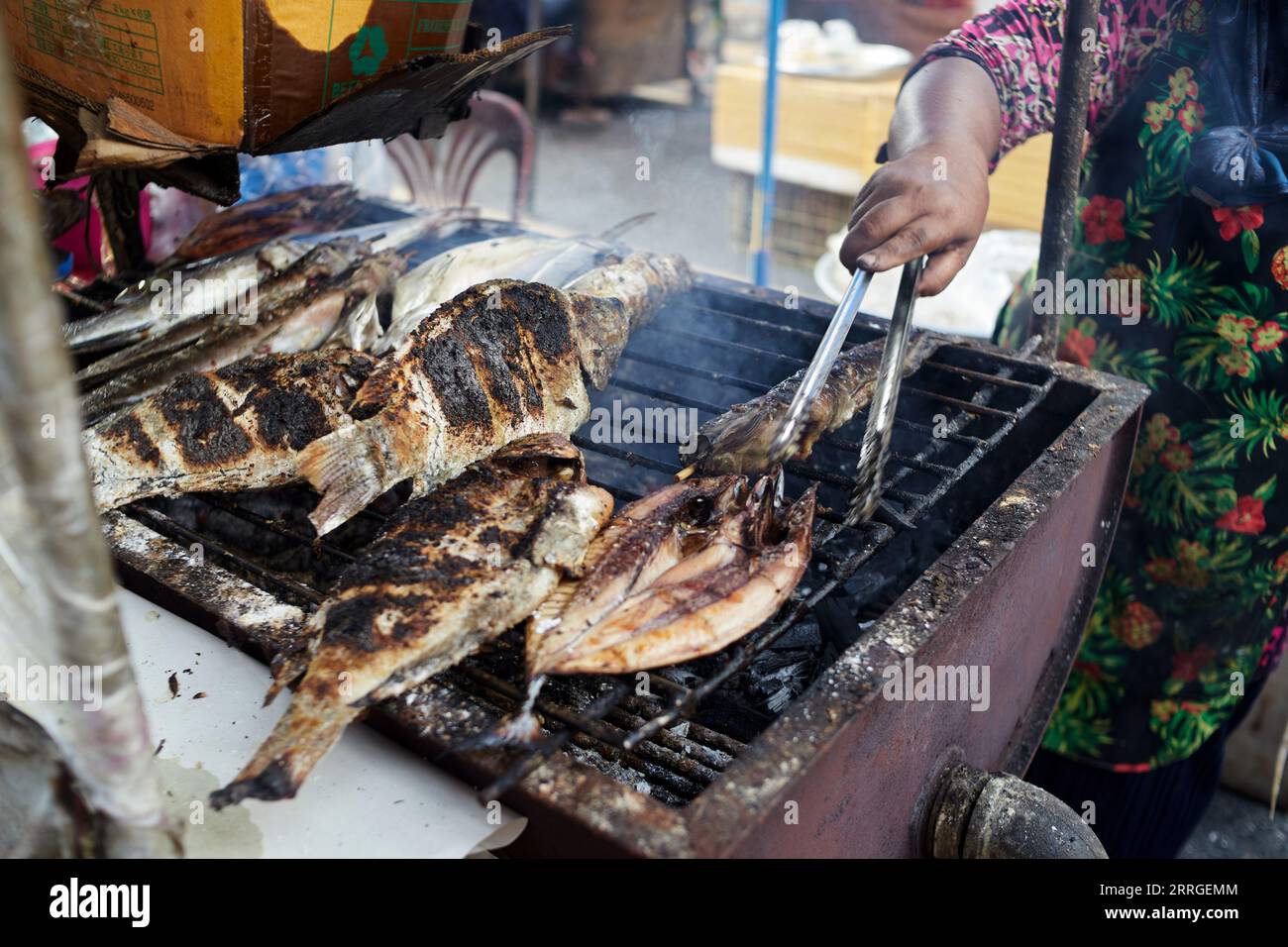 Salt crusted grilled tilapia fish on hot stove Stock Photo Alamy