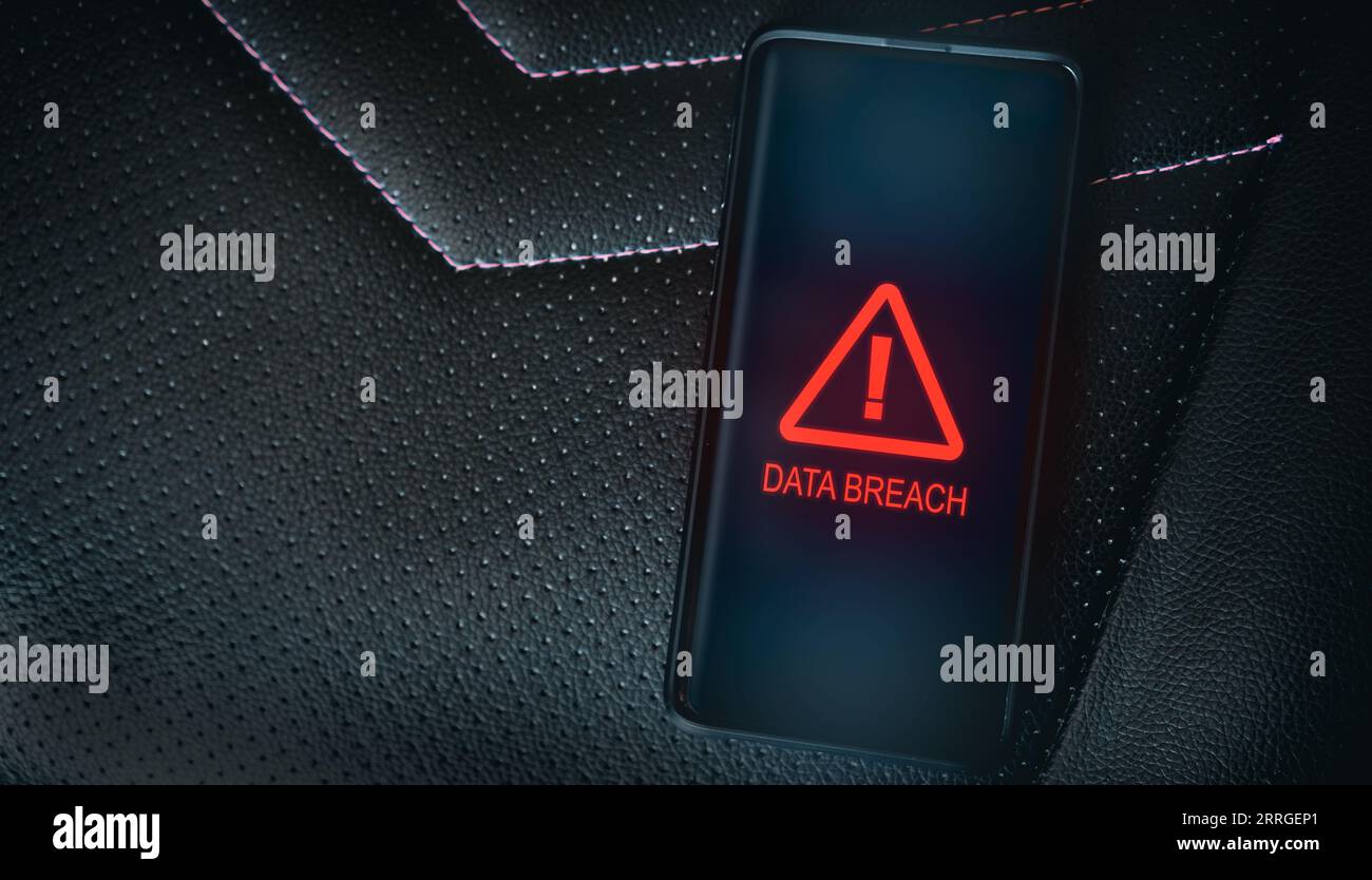 Top view photo of smartphone with system warning alert on screen. Compromised information concept. Data breach. Malicious software. Virus crime. Stock Photo