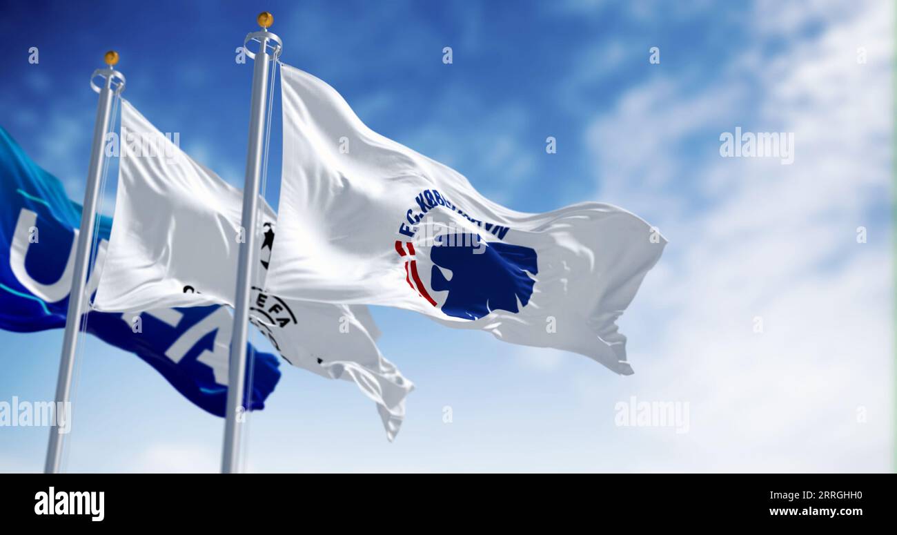 Copenhagen, DK, August 31 2023: Flags of the Copenhagen football club, UEFA and the Champions League fluttering in the wind. Illustrative editorial 3d Stock Photo