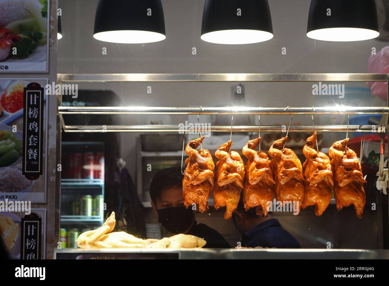 220524 -- SINGAPORE, May 24, 2022 -- Photo shows a stall selling chicken  rice in Singapore s city centre on May 24, 2022. The Ministry of Trade and  Industry MTI and Monetary