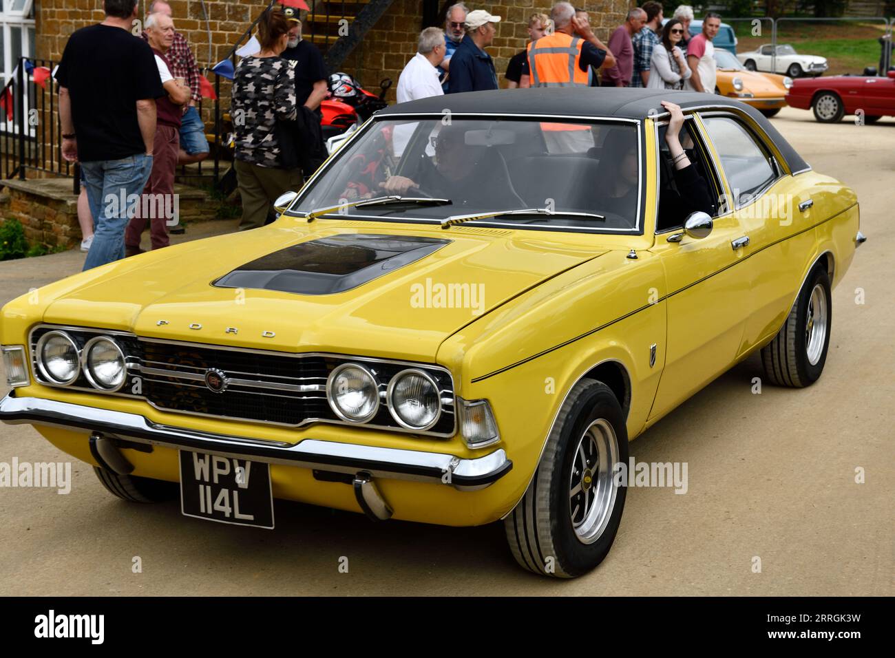 Cotswolds, UK. 13th Aug, 2023. Ford Cortina leaving Hook Norton Brewery ...