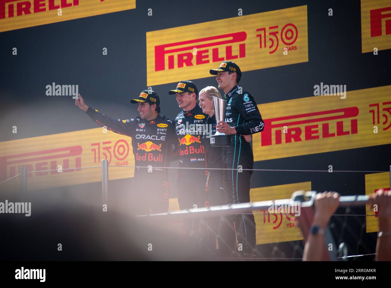George Russell, Max Verstappen, and Sergio Perez stand together on the podium, following their wins at the Spanish Grand Prix. Stock Photo