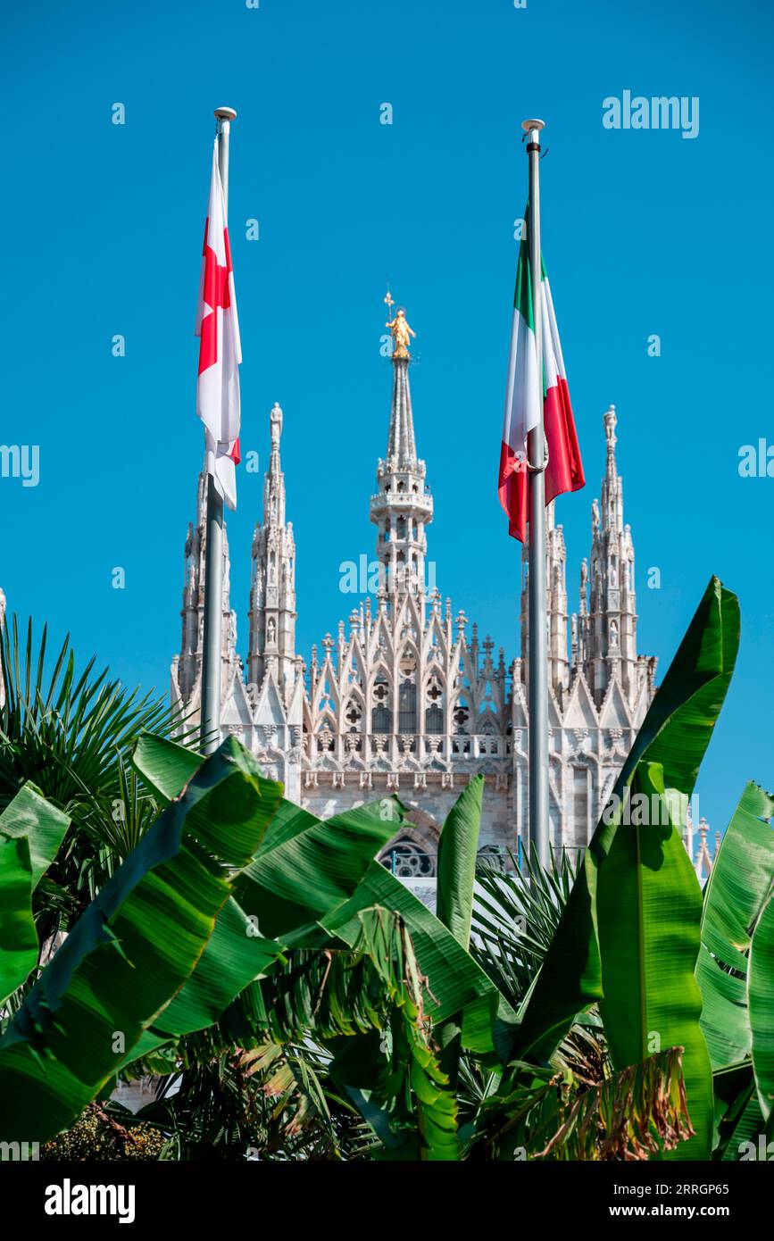 View of the Milan Cathedral and the square. Duomo di Milano. Overview of the facade of the cathedral in white marble. Buttresses, pinnacles. Italy Stock Photo