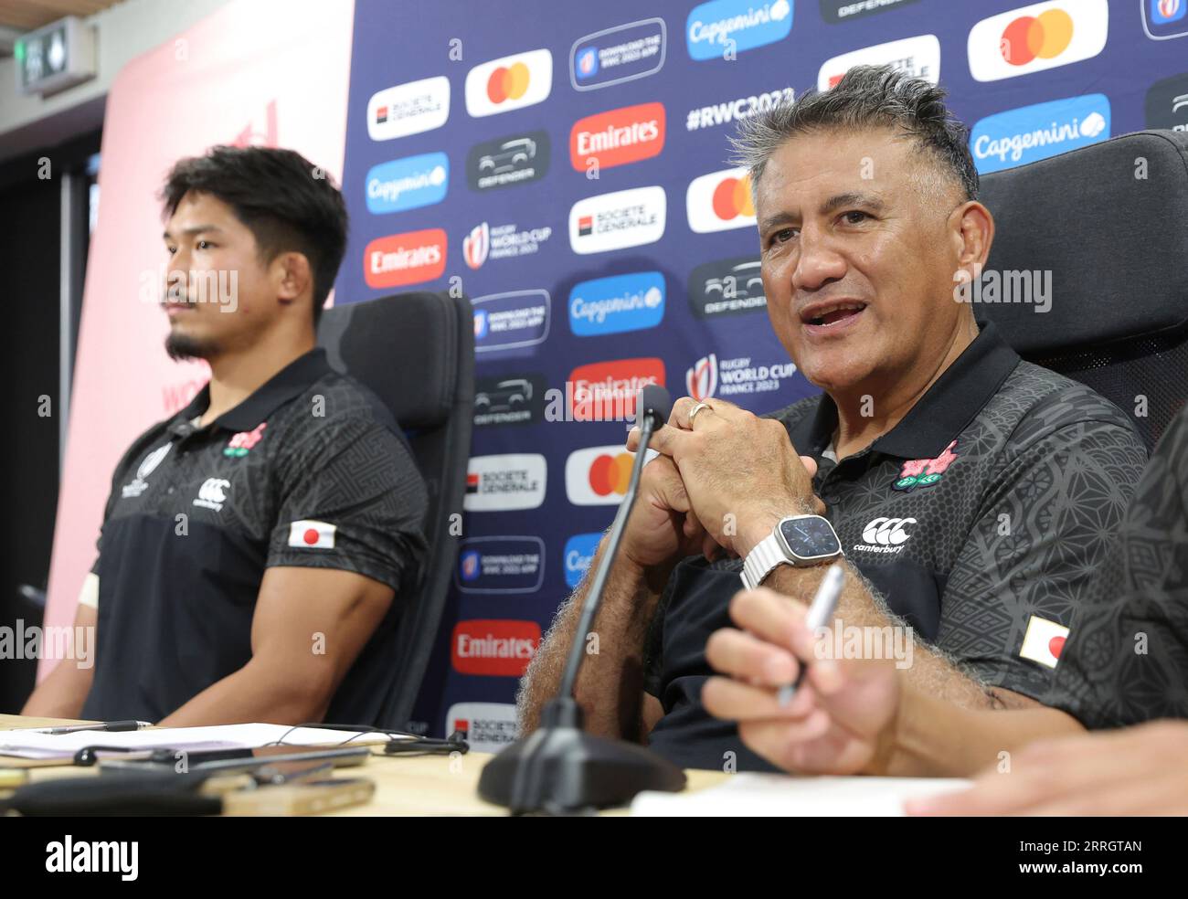 Kazuki Himeno (L) and James Whitinui Joseph head coach of the Japanese  national rugby union team (Cherry Blossoms, Sakura  The Brave Blossoms)  attend a press conference prior to their first match