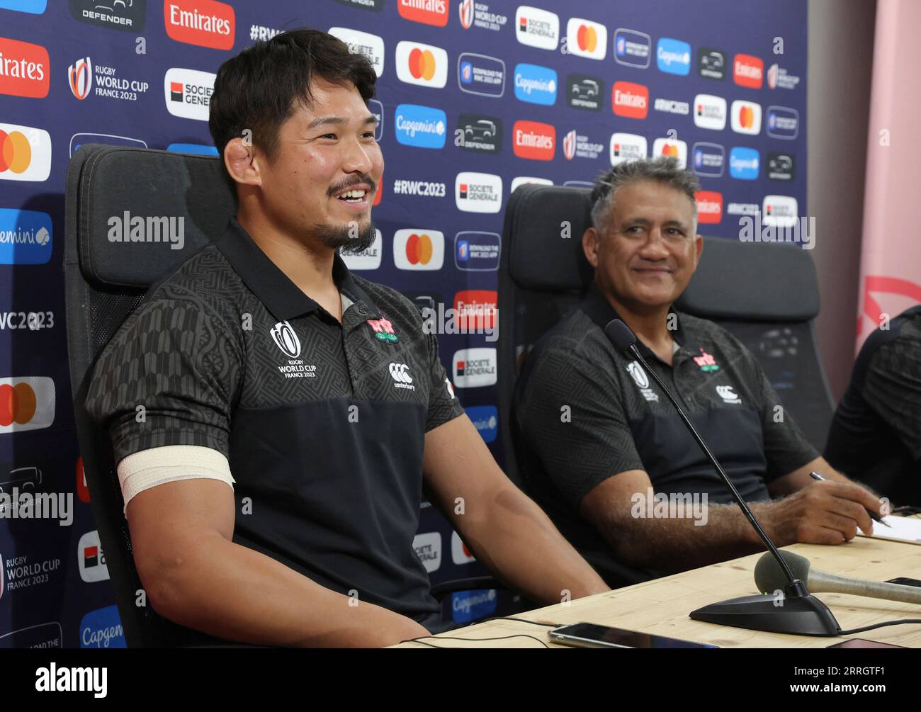 Kazuki Himeno (L) and James Whitinui Joseph head coach of the Japanese  national rugby union team (Cherry Blossoms, Sakura  The Brave Blossoms)  attend a press conference prior to their first match