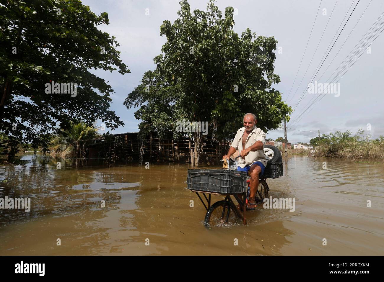 220603 -- RECIFE, June 3, 2022 -- An elderly man rides a bicycle on a flooded street after flooding caused by heavy rains in Uribeca, Recife, Brazil, June 2, 2022. The death toll from heavy rains last week in the Brazilian city of Recife and its metropolitan area has risen to 126, with two people still missing, the government of the northeastern state of Pernambuco said Thursday. Photo by /Xinhua BRAZIL-HEAVY RAINS-DAMAGES LucioxTavora PUBLICATIONxNOTxINxCHN Stock Photo