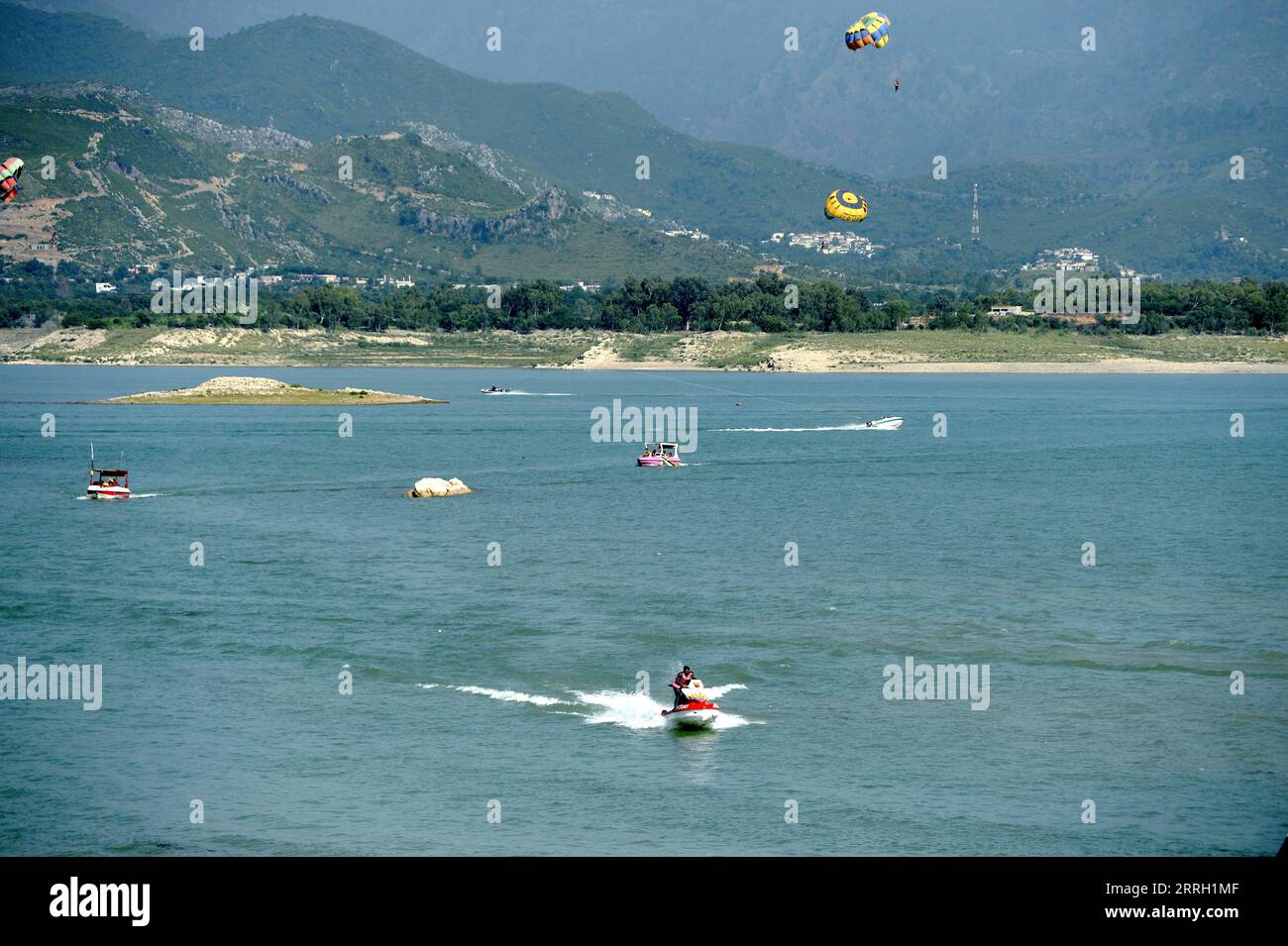 220608 -- KHANPUR, June 8, 2022 -- Tourists enjoy water sports activities at Khanpur Lake in Khanpur of Pakistan s northwestern Khyber Pakhtunkhwa province on June 8, 2022.  PAKISTAN-KHANPUR-DAILY LIFE-WATER SPORTS AhmadxKamal PUBLICATIONxNOTxINxCHN Stock Photo