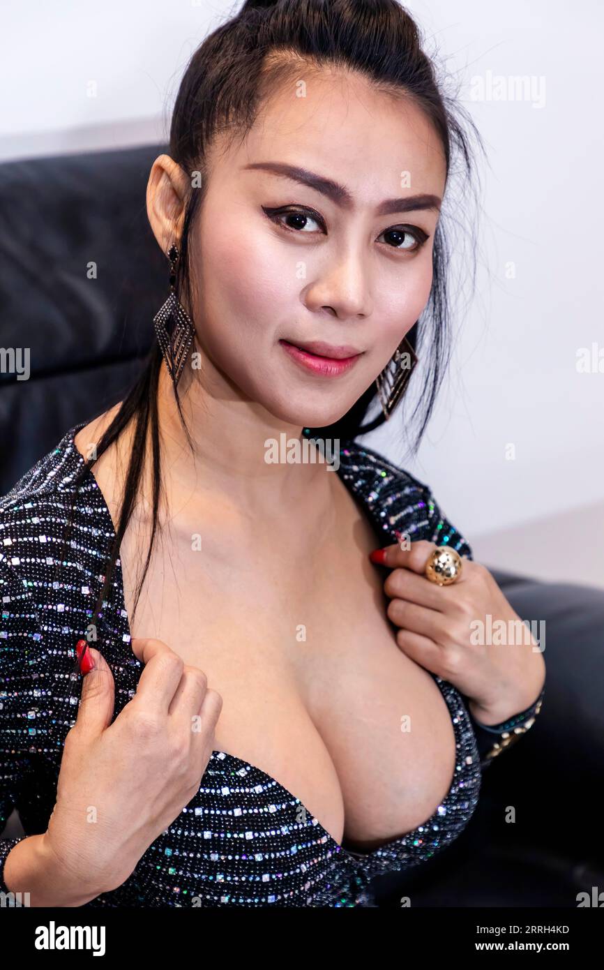 Sexy, beautiful asian lady with big breasts posing, Bangkok, Thailand Stock Photo