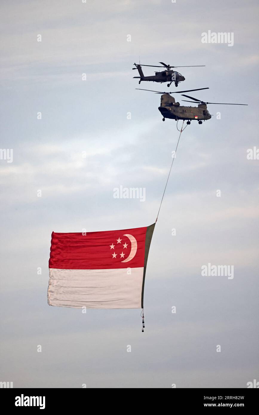 Helicopters in flight trailing th…