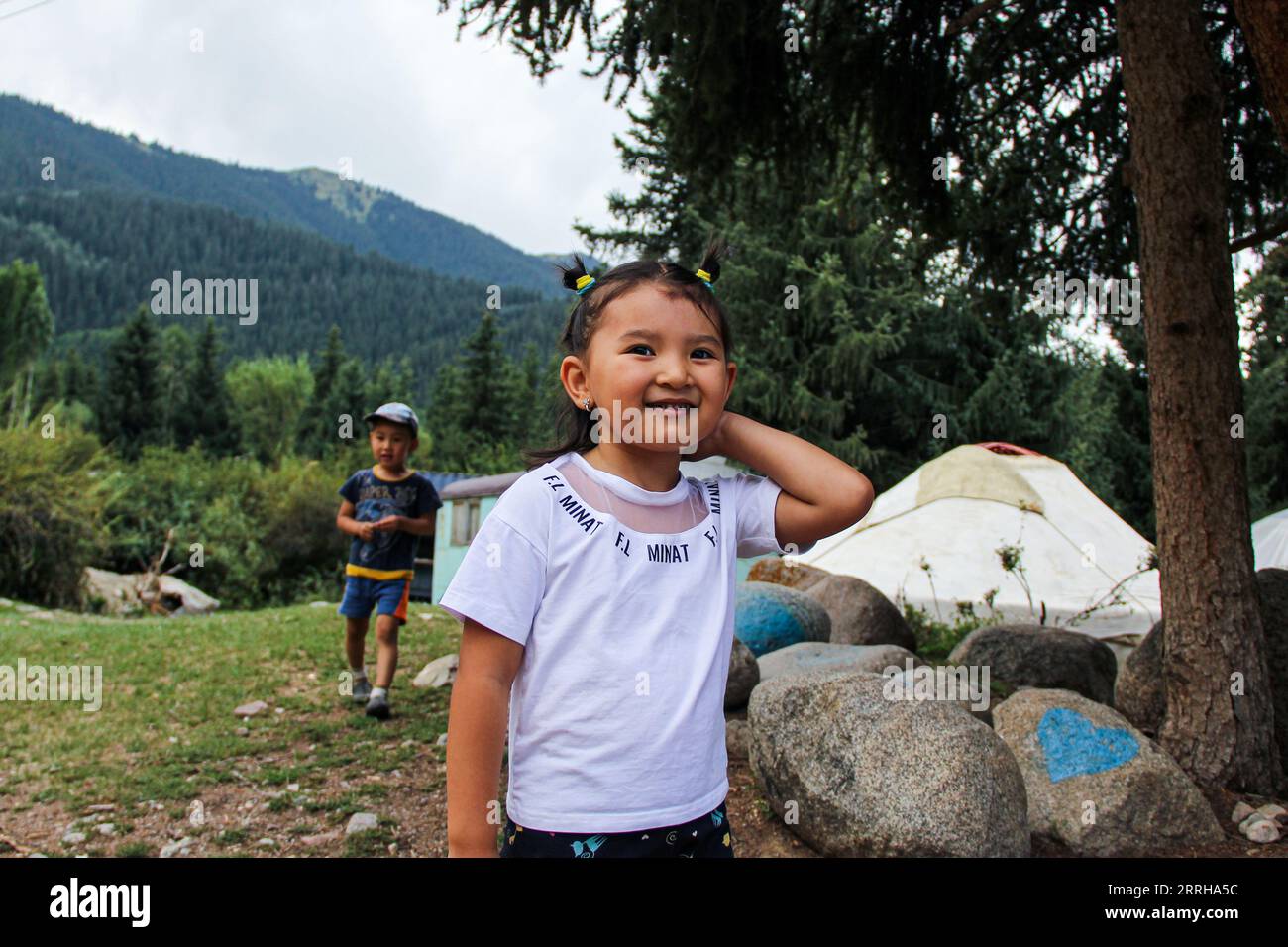 The Kyrgyz kids are in nature, Kyrgyzstan Stock Photo