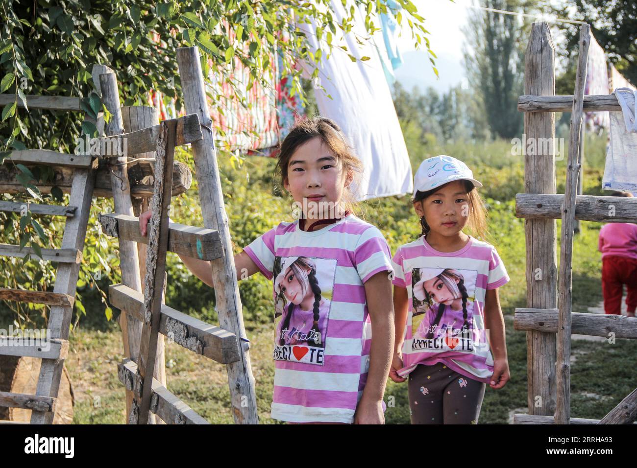 Two young Kyrgz kids in front of their house, Chon Kemin, Kyrgyzstan Stock Photo