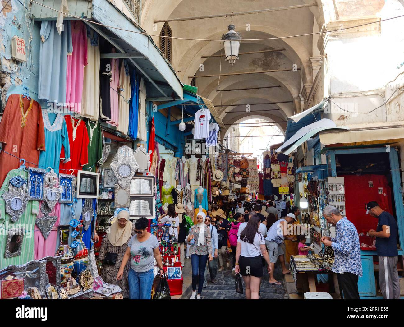 Tunis, Tunisia - 27 August, 2022: People walking in the medina quarter. The Medina contains some 700 monuments, including palaces, mosques, mausoleums Stock Photo