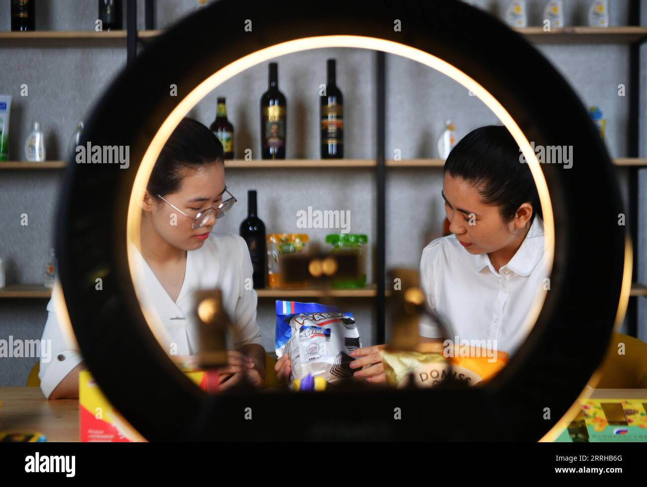 220624 -- XIAMEN, June 24, 2022 -- Staff members sell products via live streaming at the commodity service center for products of the BRICS countries in Xiamen City, southeast China s Fujian Province, June 23, 2022. The service center has been set up at Xiamen Cross-border E-commerce Industrial Park, with over 700 products displayed and sold. In recent years, Xiamen has expanded its trade cooperation with the other BRICS countries. Between January and May this year, Xiamen s import and export volume to BRICS countries recorded 28.34 billion yuan about 4.23 billion U.S. dollars.  CHINA-FUJIAN-X Stock Photo