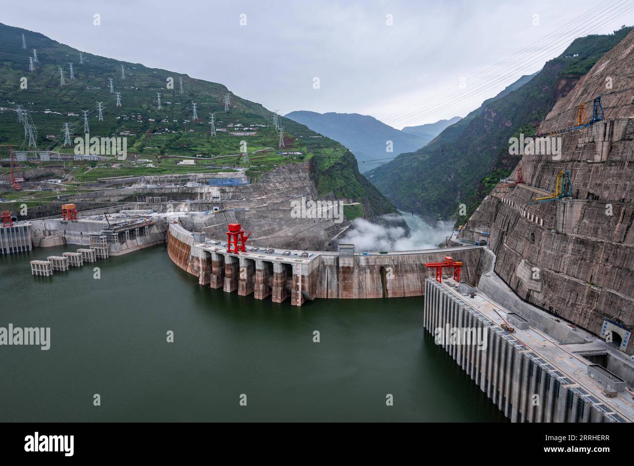 220628 -- KUNMING, June 28, 2022 -- Aerial photo taken on June 28, 2022 shows a view of the Baihetan hydropower station, which straddles the provinces of Yunnan and Sichuan in southwest China. Tuesday marks the first anniversary of the operation of the first two generating units of the Baihetan hydropower station, a major project in China s west-east power transmission program. The station has a total installed capacity of 16 million kilowatts. The hydropower station is located on the Jinsha River, the upper section of the Yangtze River in southwest China.  CHINA-BAIHETAN HYDROPOWER STATION-FI Stock Photo