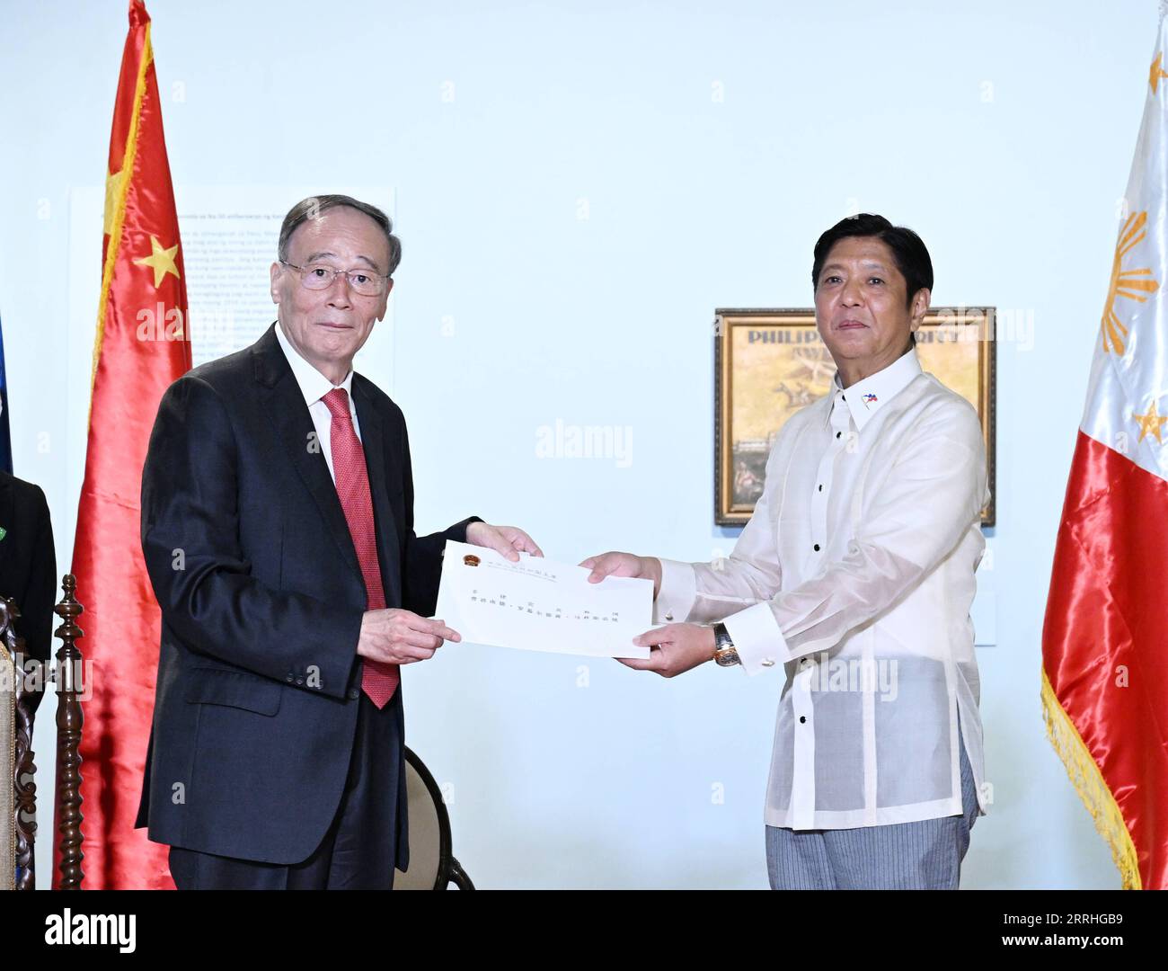220630 -- MANILA, June 30, 2022 -- Chinese Vice President Wang Qishan delivers a congratulatory letter from Chinese President Xi Jinping to Philippine President Ferdinand Romualdez Marcos during their meeting in Manila, the Philippines, June 30, 2022. As Chinese President Xi Jinping s special representative, Wang attended the Philippine presidential inauguration of Ferdinand Romualdez Marcos on Thursday at the invitation of the government of the Philippines.  PHILIPPINES-MANILA-PRESIDENT-CHINA-WANG QISHAN-MEETING ZhangxLing PUBLICATIONxNOTxINxCHN Stock Photo