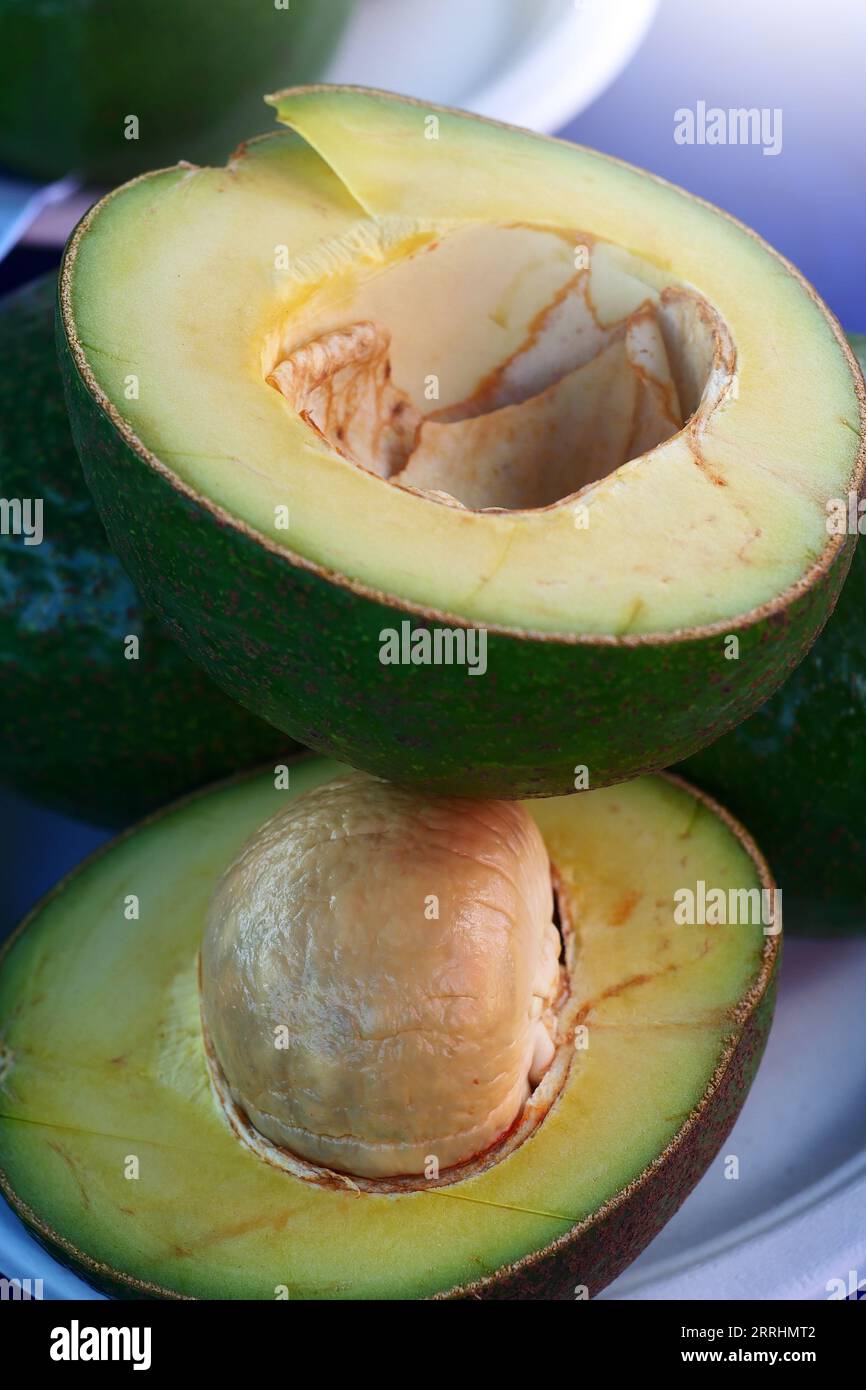 Fresh Avocados fruit on nature background. Stock Photo