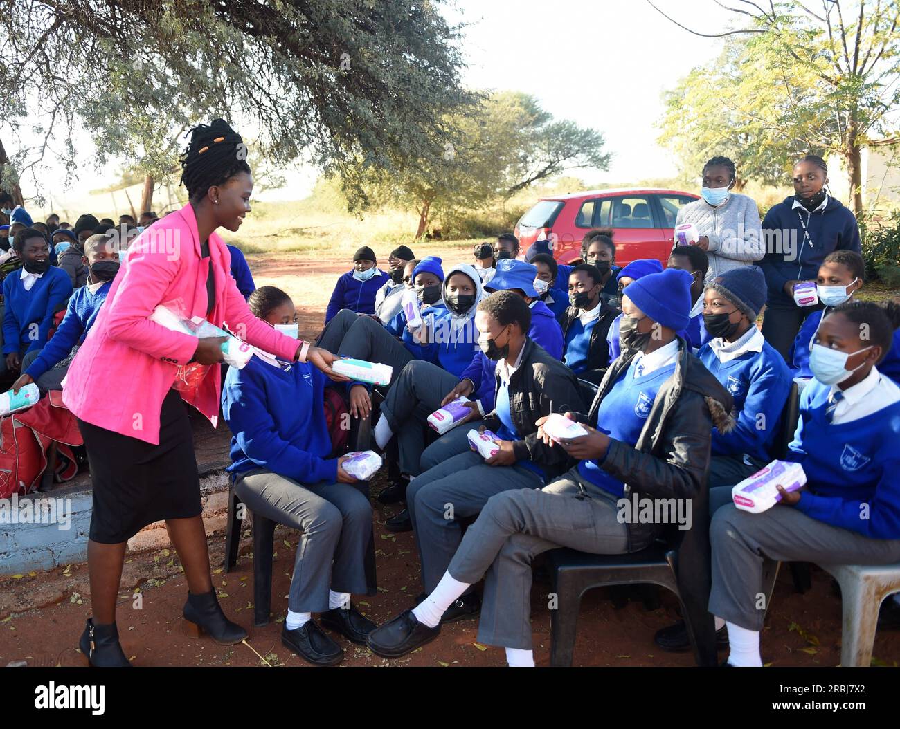 220715 -- MOCHUDI BOTSWANA, July 15, 2022 -- Agrieneth Masule L, Front, who runs a feminine hygiene project that raises funds for sanitary pads given to needy girls through Motlaletsi Charity Club, distributes sanitary pads to students at Kgamanyane Community Junior Secondary School in Mochudi, a village in Kgatleng district, Botswana, on June 20, 2022. Period poverty, defined as a lack of access to menstrual products, education, and hygiene, causes one in every 10 African girls to miss school each year, according to the United Nations Children s Fund. Without proper education and resources, g Stock Photo