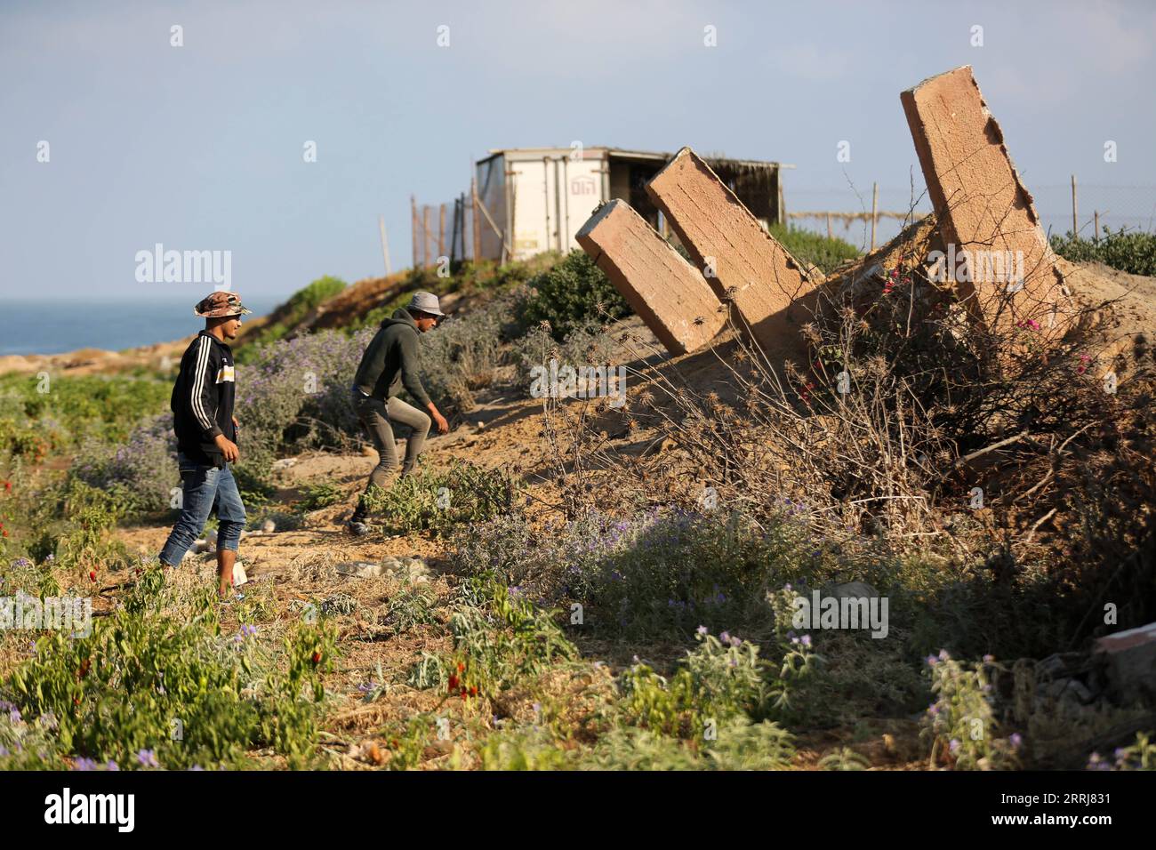 220716 -- GAZA CITY, July 16, 2022 -- People inspect the damages after an Israeli air strike carried out in Gaza City, on July 16, 2022. Palestinian militants fired four rockets from the Gaza Strip into Israeli territory early Saturday. There were no casualties or damage as a result of the attacks. Israeli Defense Forces IDF responded with an airstrike against targets in Gaza. Photo by /Xinhua MIDEAST-GAZA CITY-AIRSTRIKE YasserxQudih PUBLICATIONxNOTxINxCHN Stock Photo