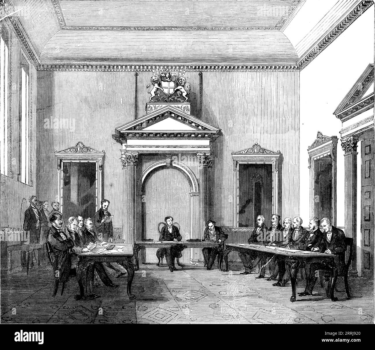 The New Indian Council Chamber, 1858. Meeting room in India House, London. View of '...the chamber in which the new Council of India now holds its deliberations. On entering this apartment...there is some little evidence of the wealth and splendour of the great association of merchant princes. It is situated on the western side of the main entrance to the building in Leadenhall-street, and is a remarkably handsome and commodious room. It is spacious and lofty, and is lighted by three windows. It is said to form an exact cube of thirty feet. It is splendidly ornamented by gilding and large look Stock Photo