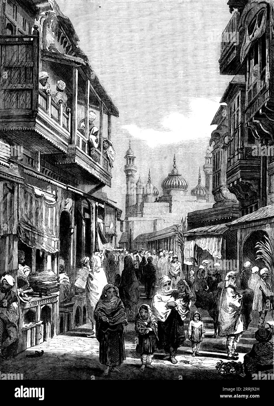 Street Scene in Lahore - from drawings by W. Carpenter, Jun., 1858. Few cities have undergone the vicissitudes to which the capital of the Punjaub has been subjected. It is on the highroad from Central Asia to the rich plains of India, which have been, the desire of every Moslem conqueror...Its brightest time was, perhaps, that when Jehangir made it his winter quarters on returning from Cashmere; and almost the only buildings of importance now remaining date from that period. But its present aspect was given to it during the sovereignty of Runjeet Singh, who built the walls and ditch (about fo Stock Photo