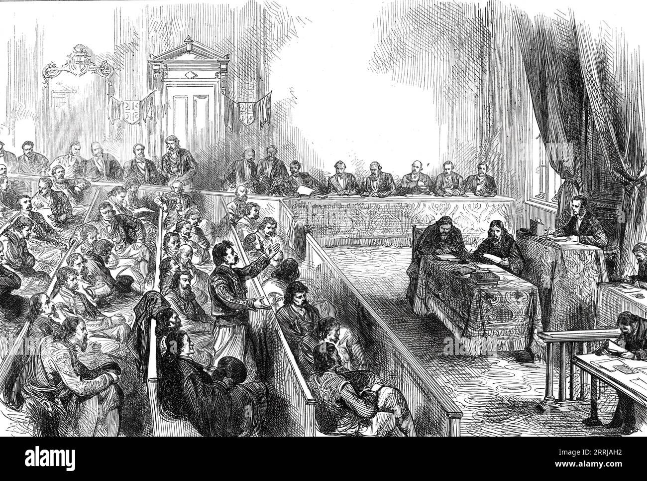 Sitting of the Skouptschina, or Parliament of Servia, 1876. Engraving after a sketch by '...M. Charles Yriarte, the well-known French traveller and historian. It represents a scene which strikes the observer as quaint and peculiar, from the mixture of common European dress with the flowing robes of the Greek Church priests, several of whom are members of this assembly, and with the furred tunics and high boots of the rustic nobles or landed gentry. The debates of the Skouptschina have during their last session been watched with some anxiety, lest Servia should openly take up the cause of the i Stock Photo