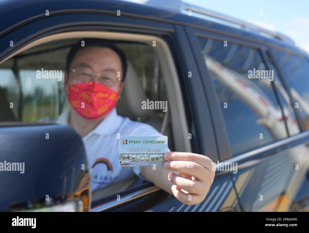 220718 -- PHNOM PENH, July 18, 2022 -- A staff member shows an e-pass ...