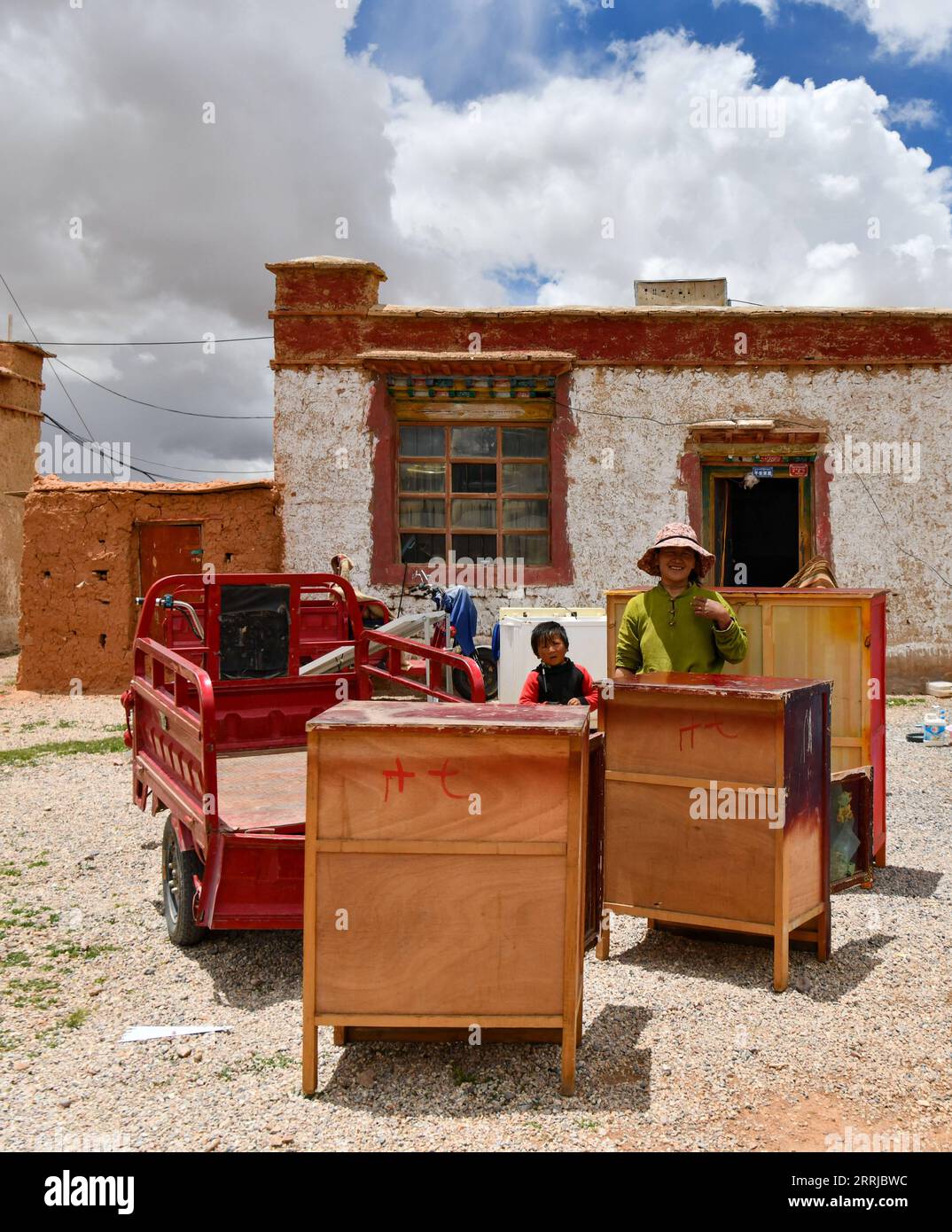 220719 -- NAGQU, July 19, 2022 -- Villagers prepare to transport furniture for relocation in Doima Township of Tsonyi County, southwest China s Tibet Autonomous Region, July 12, 2022. Tsonyi County, southwest China s Tibet Autonomous Region, started the relocation of its second batch of residents on Tuesday, as part of the region s plan to improve people s living conditions and protect the fragile local ecosystem. With an average altitude of over 5,000 meters, Tsonyi County covers a total area of 120,000 square km and is part of the Changtang National Nature Reserve, China s biggest and highes Stock Photo