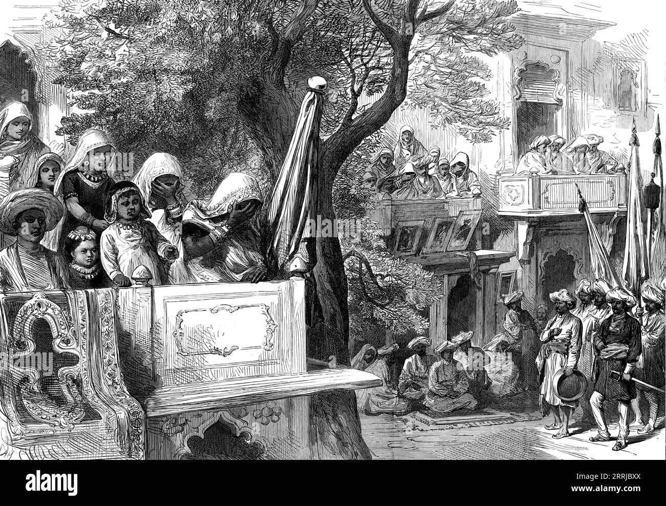 The Royal Visit to India: waiting for the Shahzadah, Gwalior, from a sketch by one of our special artists, 1876. '...his Royal Highness went to visit Scindia at Gwalior...The townspeople of Lushkur, adjoining Scindia's residence, were in eager expectation of the arrival of the Prince, or the &quot;Shah-zadah,&quot; as they called him; and these spectators in waiting were made the subject of one of Mr. William Simpson's sketches, whilst he likewise waited there for the Prince of Wales'. People lining the streets during a visit by the future King Edward VII, representing his mother Queen Victori Stock Photo