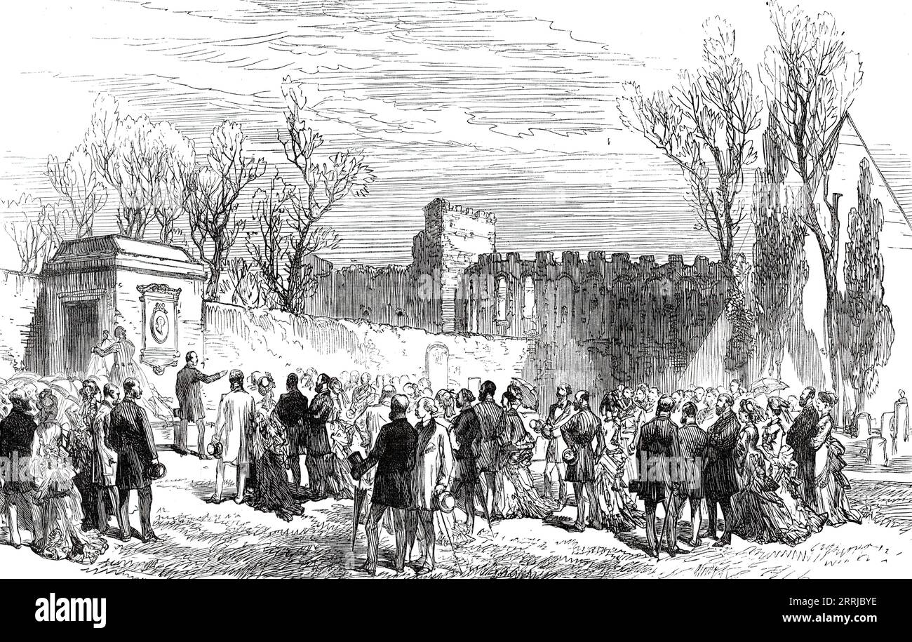 Unveiling the Memorial Tablet of Keats in the English Cemetery at Rome, 1876. 'A memorial medallion erected to the poet Keats, upon the pilaster of the gateway close to his tombstone in the Protestant burying-ground, was uncovered on Monday afternoon. An address was delivered by Major-General Sir Vincent Eyre. The sculptor, Mr. Warrington Wood, having generously declined payment for his work, Sir Vincent stated that the amount would be treated as a nucleus of a larger sum for the execution of a bust to be placed in Poets' Corner, Westminster Abbey, provided the requisite permission could be ob Stock Photo