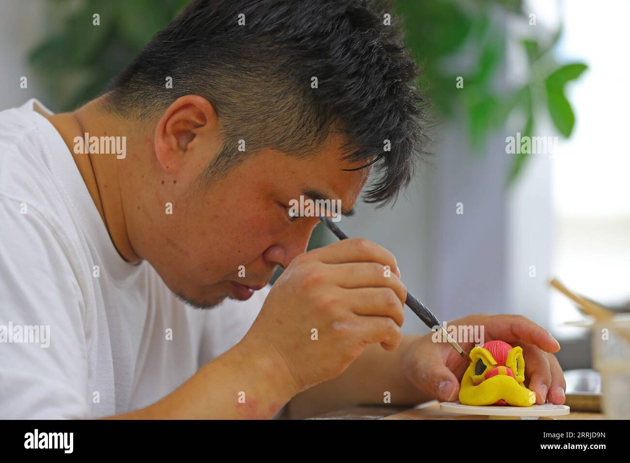 220720 -- SHENYANG, July 20, 2022 -- Chef Wu Yang makes a pastry at his studio in Shenyang, capital of northeast China s Liaoning Province, July 14, 2022. Wu Yang, a 35-year-old chef, has made pastry for ten years. Inspired by traditional Chinese culture, he has created various pastries with vivid shapes at his studio.  CHINA-LIAONING-SHENYANG-PASTRY CHEF-CHINESE CULTURE CN YangxQing PUBLICATIONxNOTxINxCHN Stock Photo