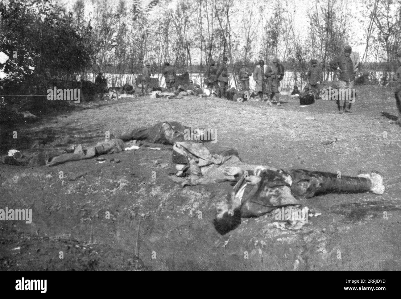 'The Italians turn things around; Bodies of Austrian soldiers killed by Italian fire on the right bank of the Piave, which they had managed to cross on the morning of November 16, 1917, with a strategy: of the first enemy line presenting itself with raised arms as if to surrender, and men behind with grenades in their their pockets. At 8 o'clock in the morning of the 17th, the Italians had driven their adversaries back to the left bank who had made their last effort', 1917. From &quot;L'Album de the 1914-1919 War, Volume 2&quot; [L'Illustration, Paris, 1924]. Stock Photo