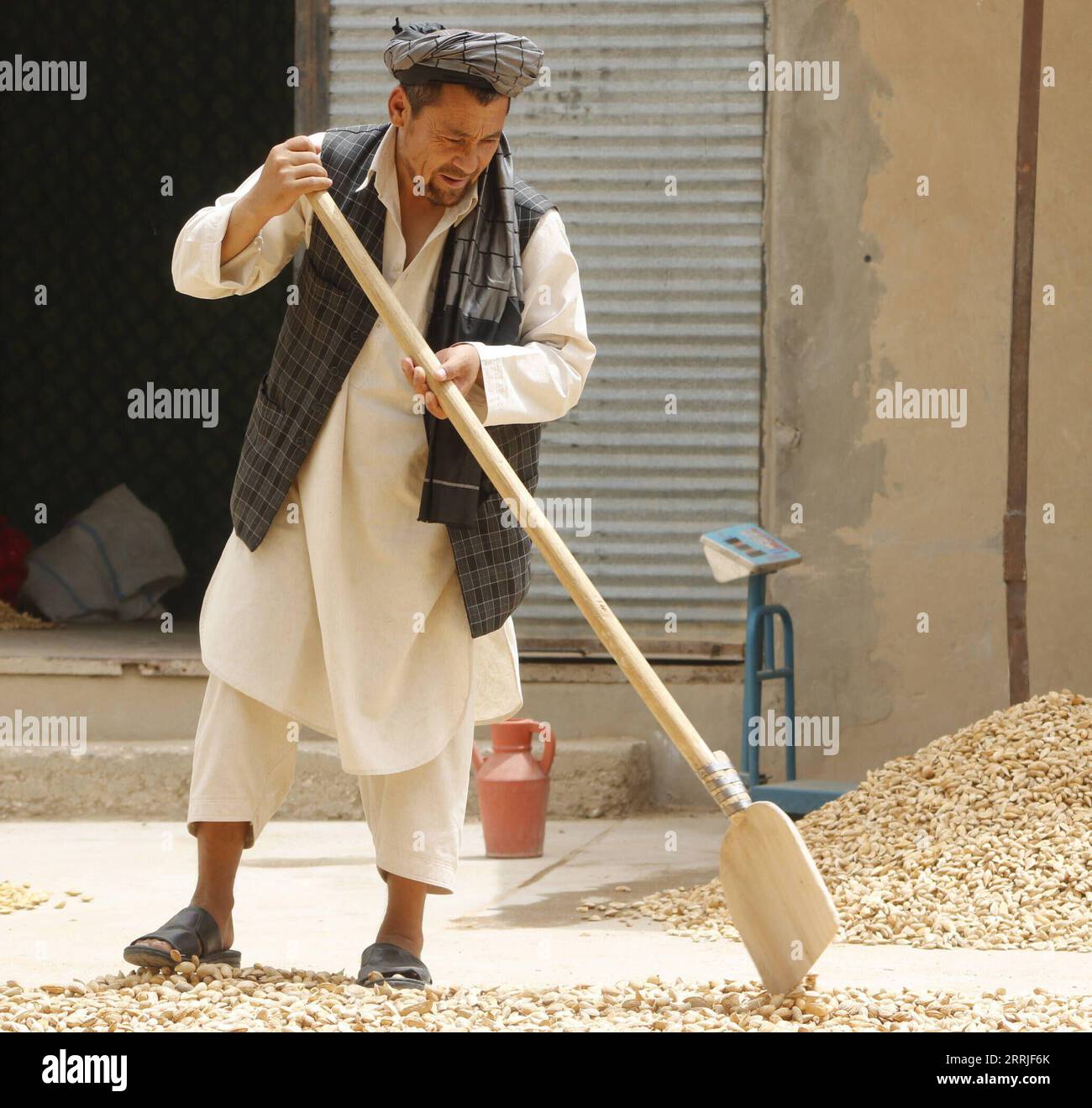 220721 -- SAMANGAN, July 21, 2022 -- An Afghan farmer works at an almond processing workshop in Samangan province, Afghanistan, July 20, 2022. Photo by /Xinhua AFGHANISTAN-SAMANGAN-ALMOND KhibarxMomand PUBLICATIONxNOTxINxCHN Stock Photo