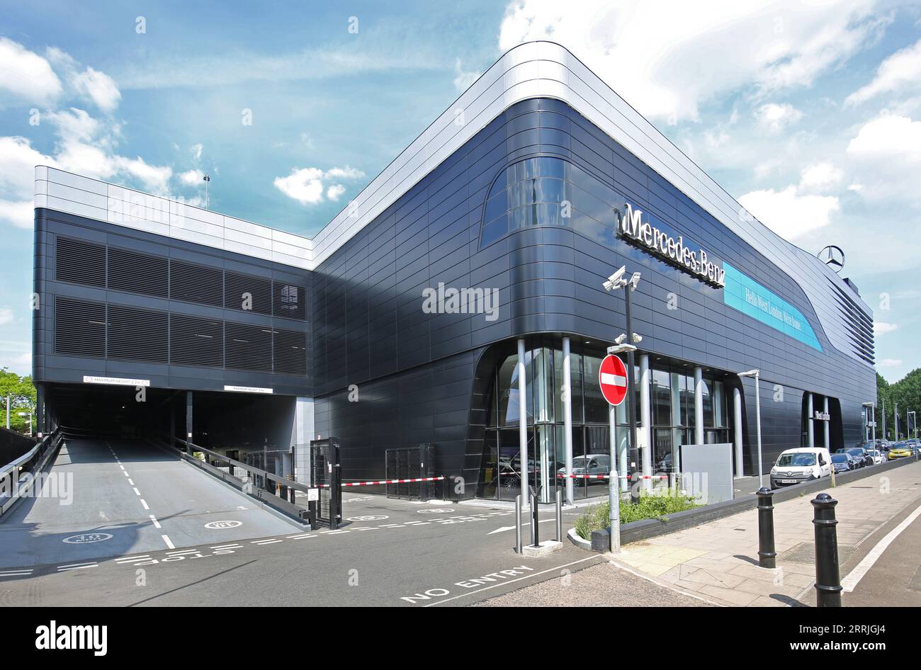 Mercedes West London, the new showroom and service centre in Brentford. main elevation, shows customer entrance and vehicle ramp. Stock Photo